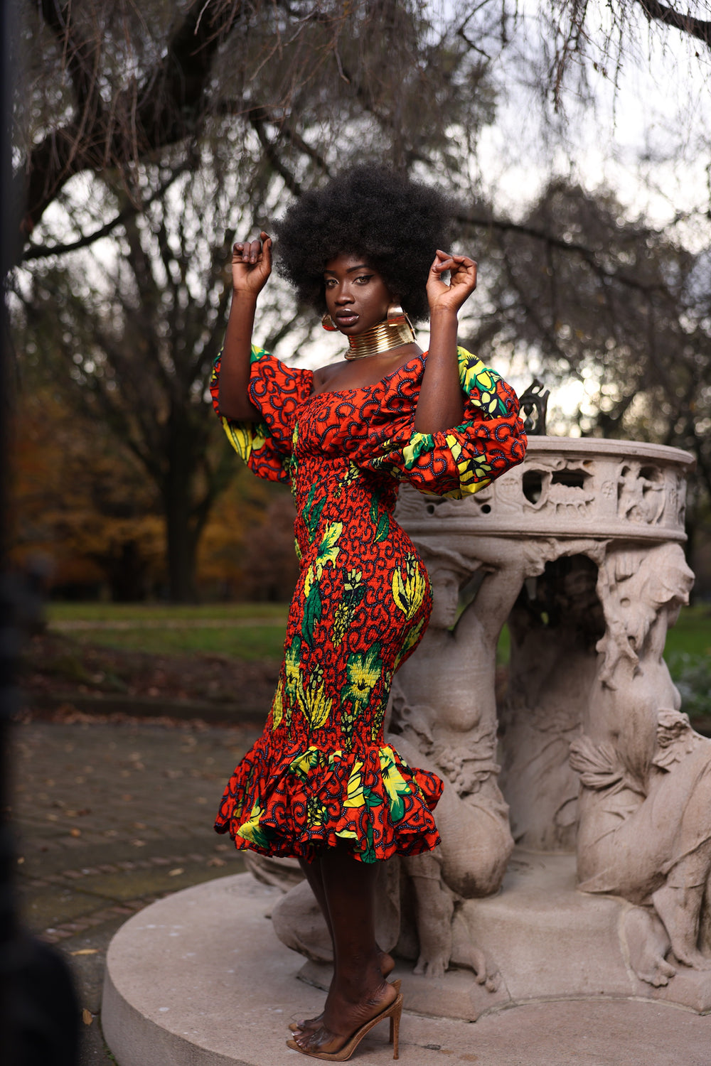 African print smoke body-con dress with puffy sleeves.