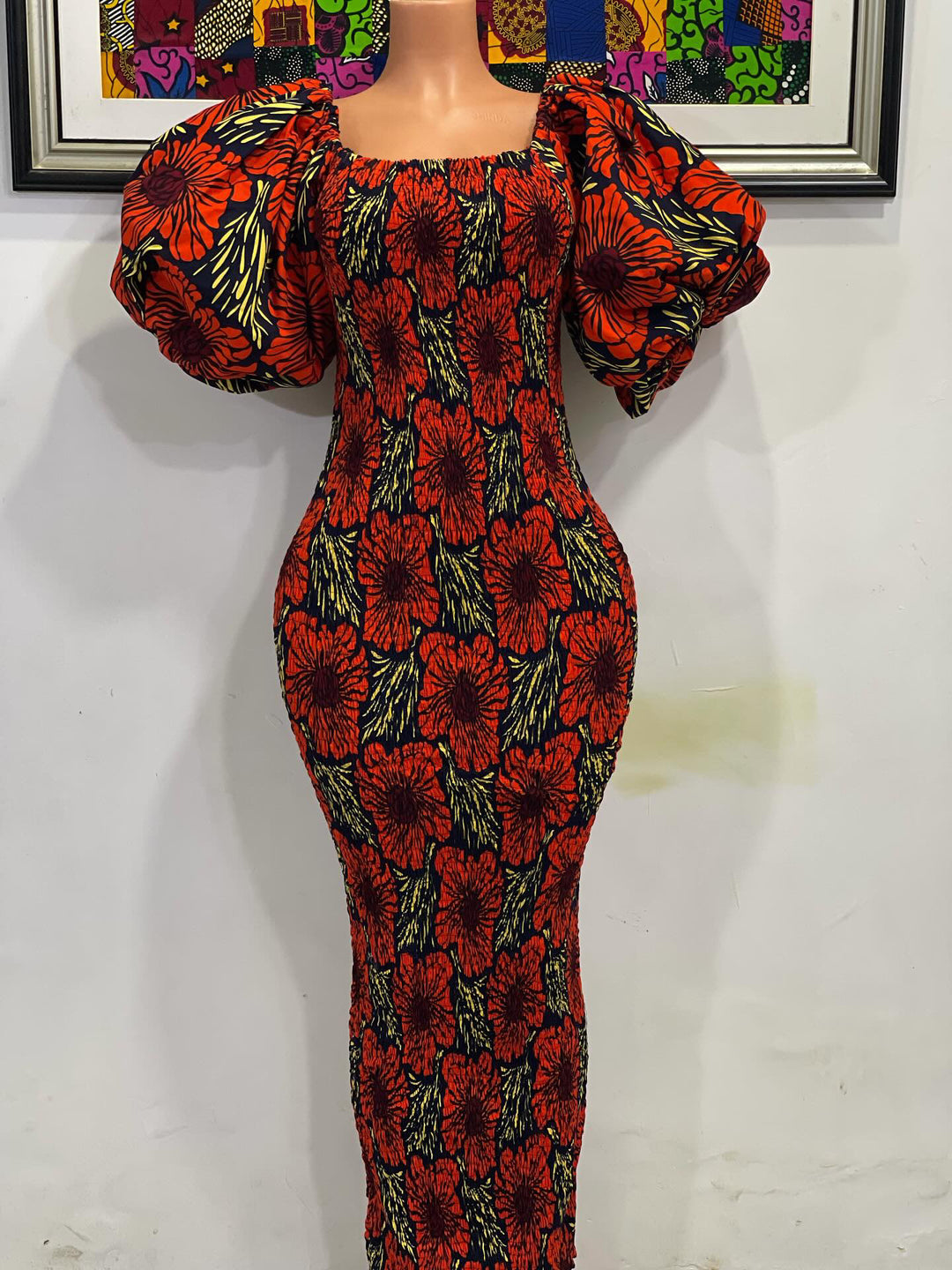 African print stretchy body-con dress with puffy sleeves.