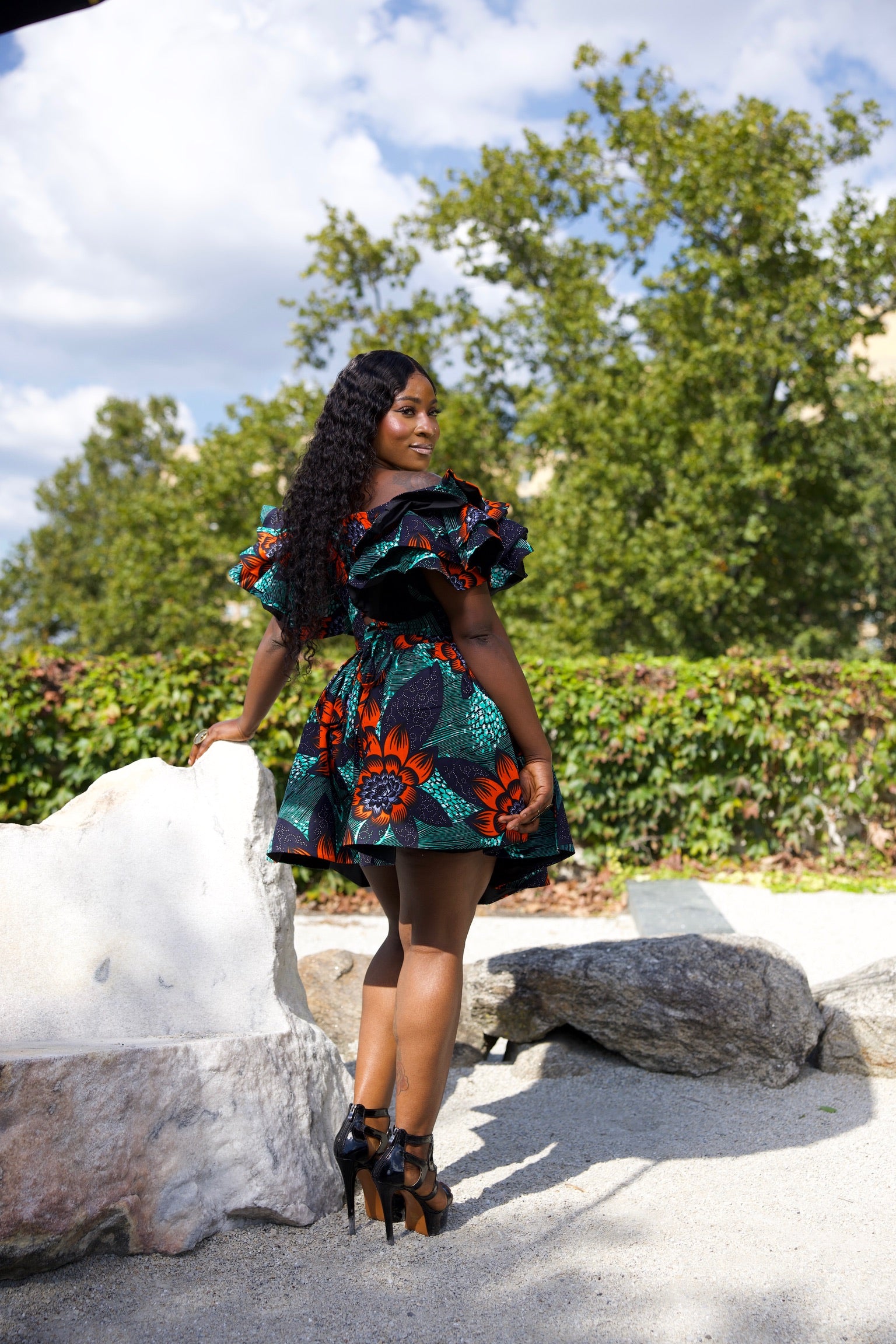 Short African print peplum skirt with dramatic sleeves corset top