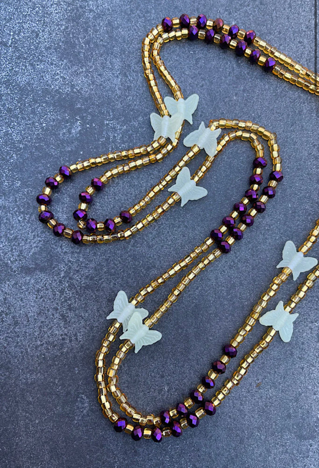 Gold and purple waist beads with glow in the dark butterfly 🦋